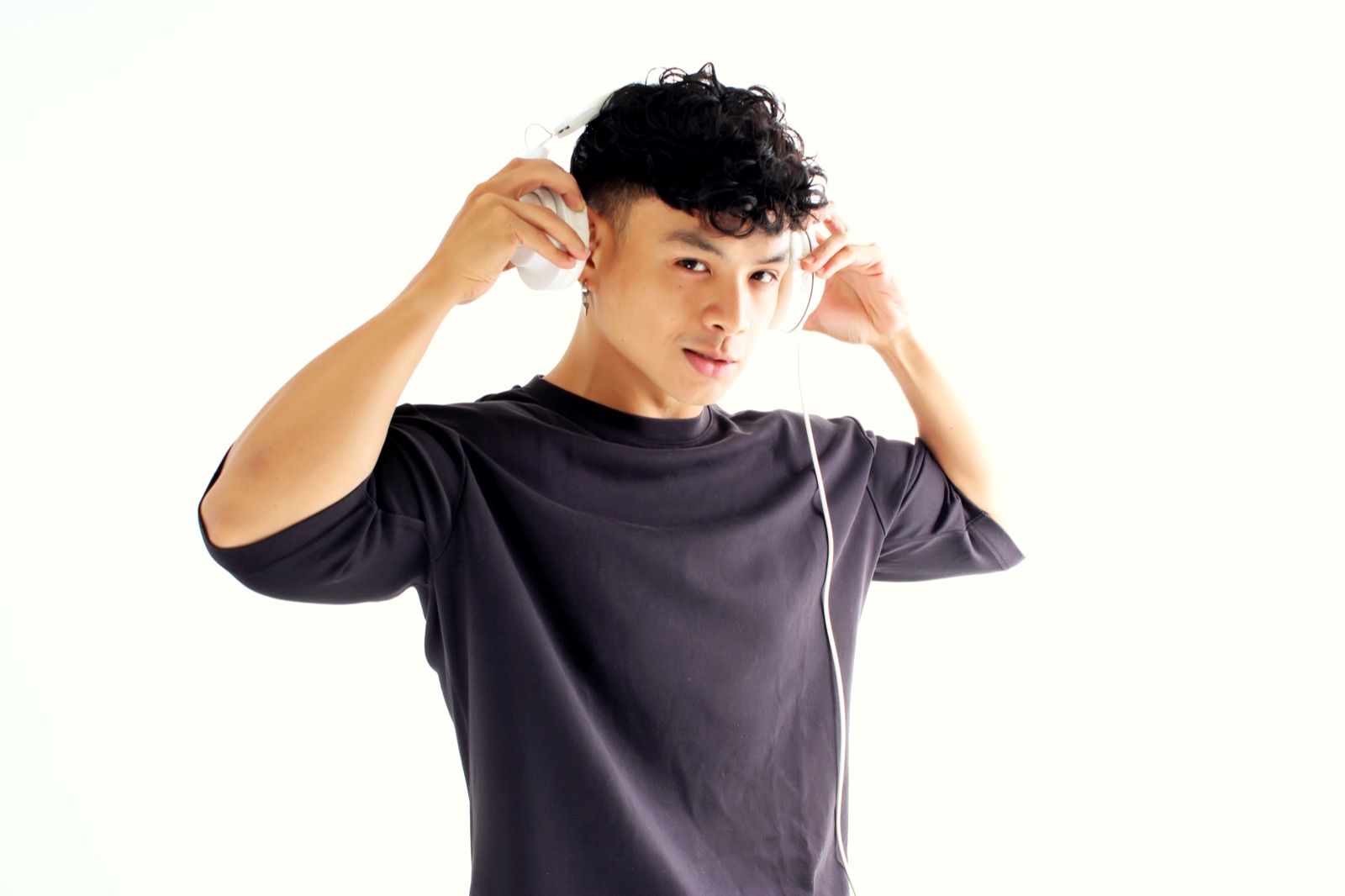 Paolo Domingo putting on his DJ headphones